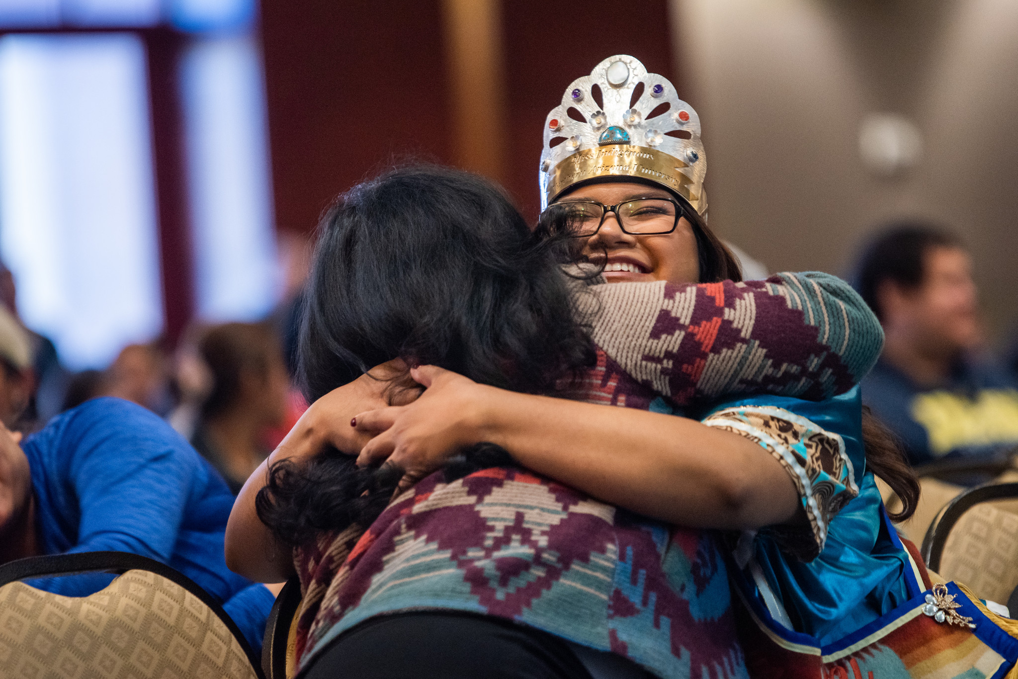 A student smiles as they are honored at Native American visit day.
