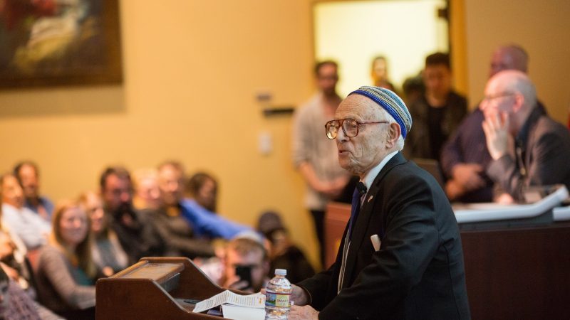 Jacob Eisenbach presenting to an audience.