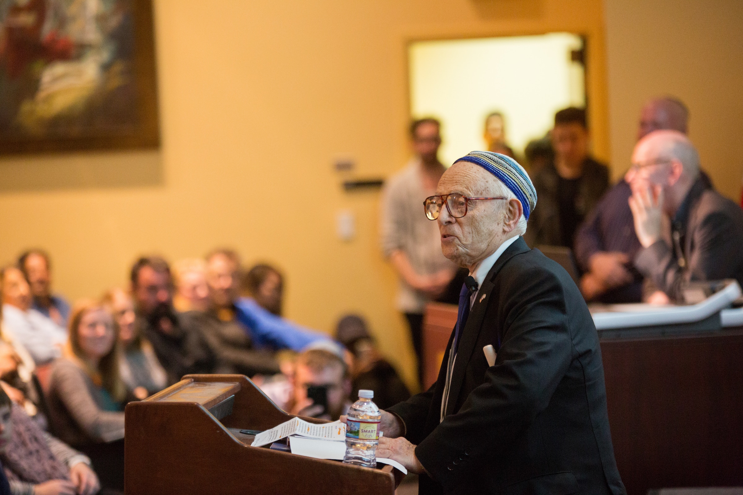 Jacob Eisenbach presenting to an audience.
