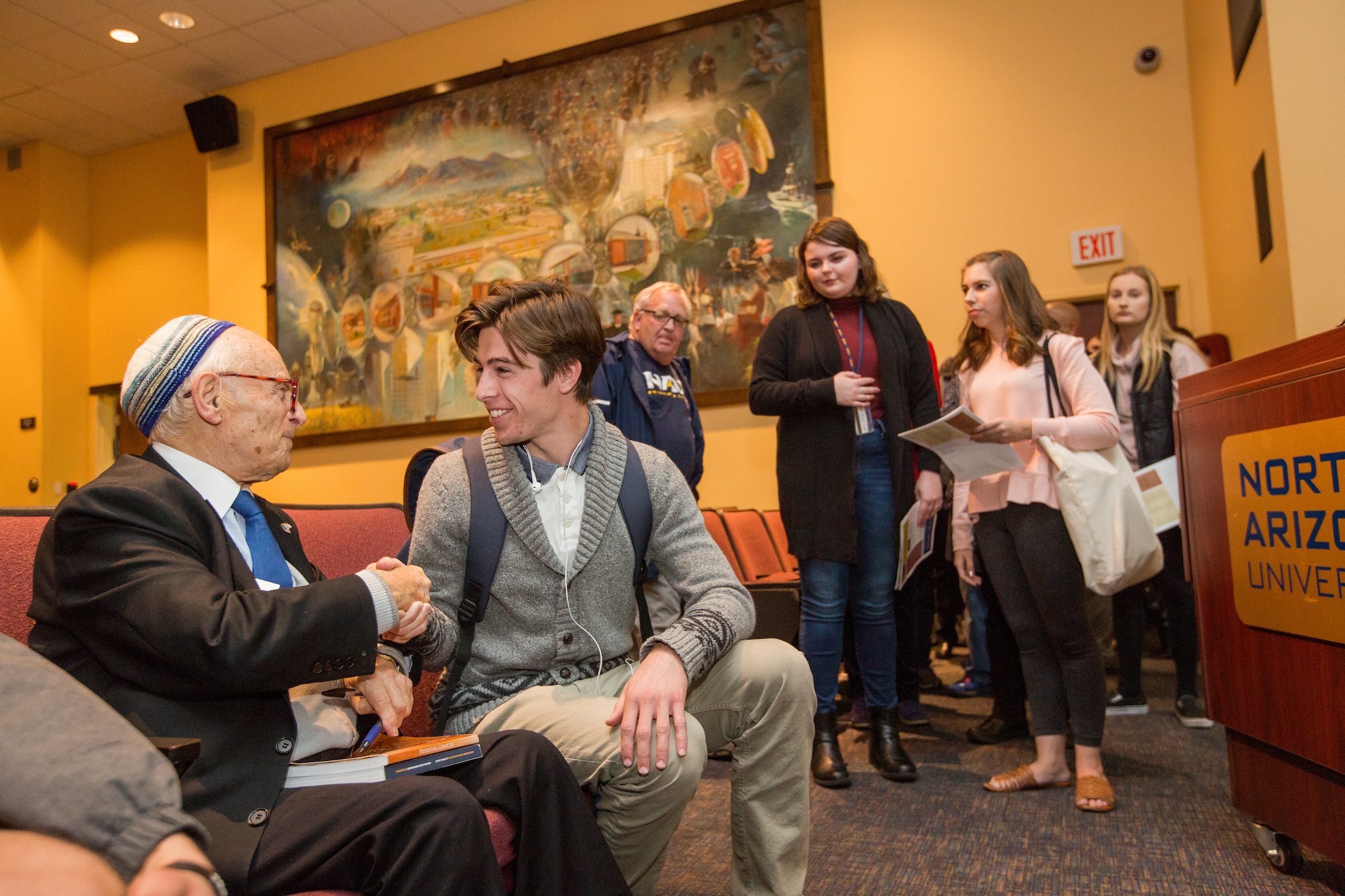 Students talking to the presenter, Jacob Eisenbach.