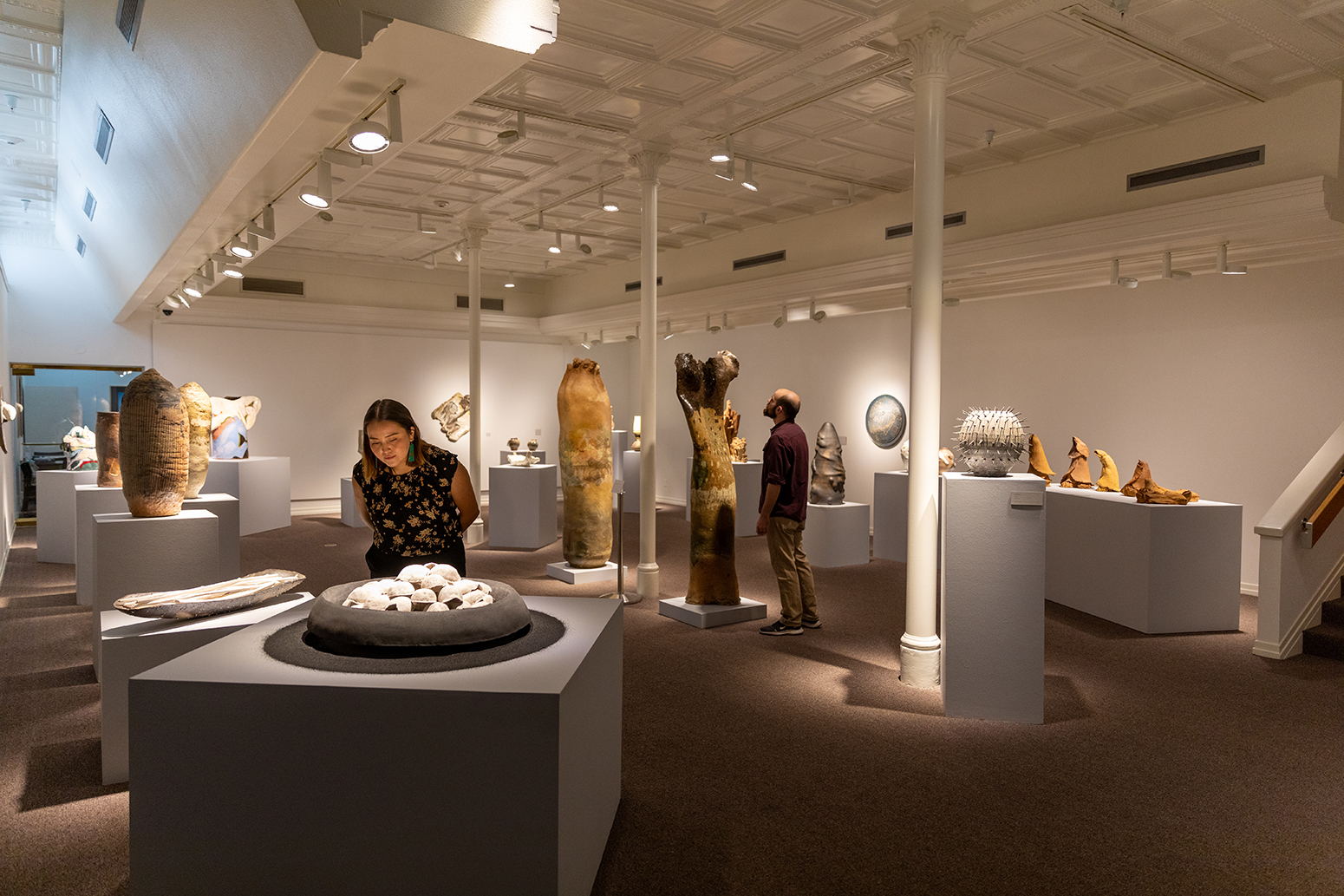 People looking at art in an art museum.