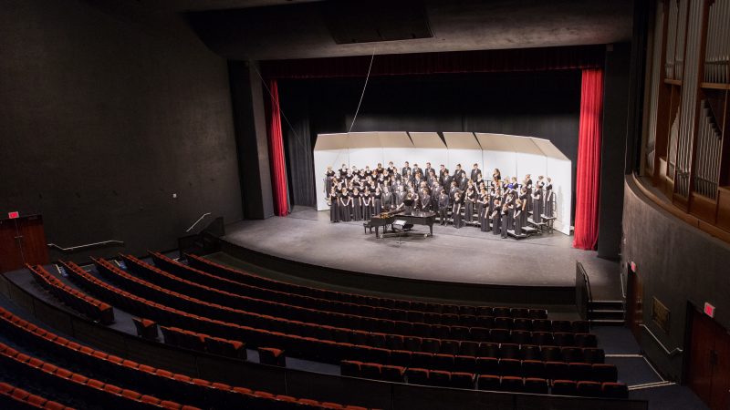 Ardrey Auditorium backseat view of choir on stage.