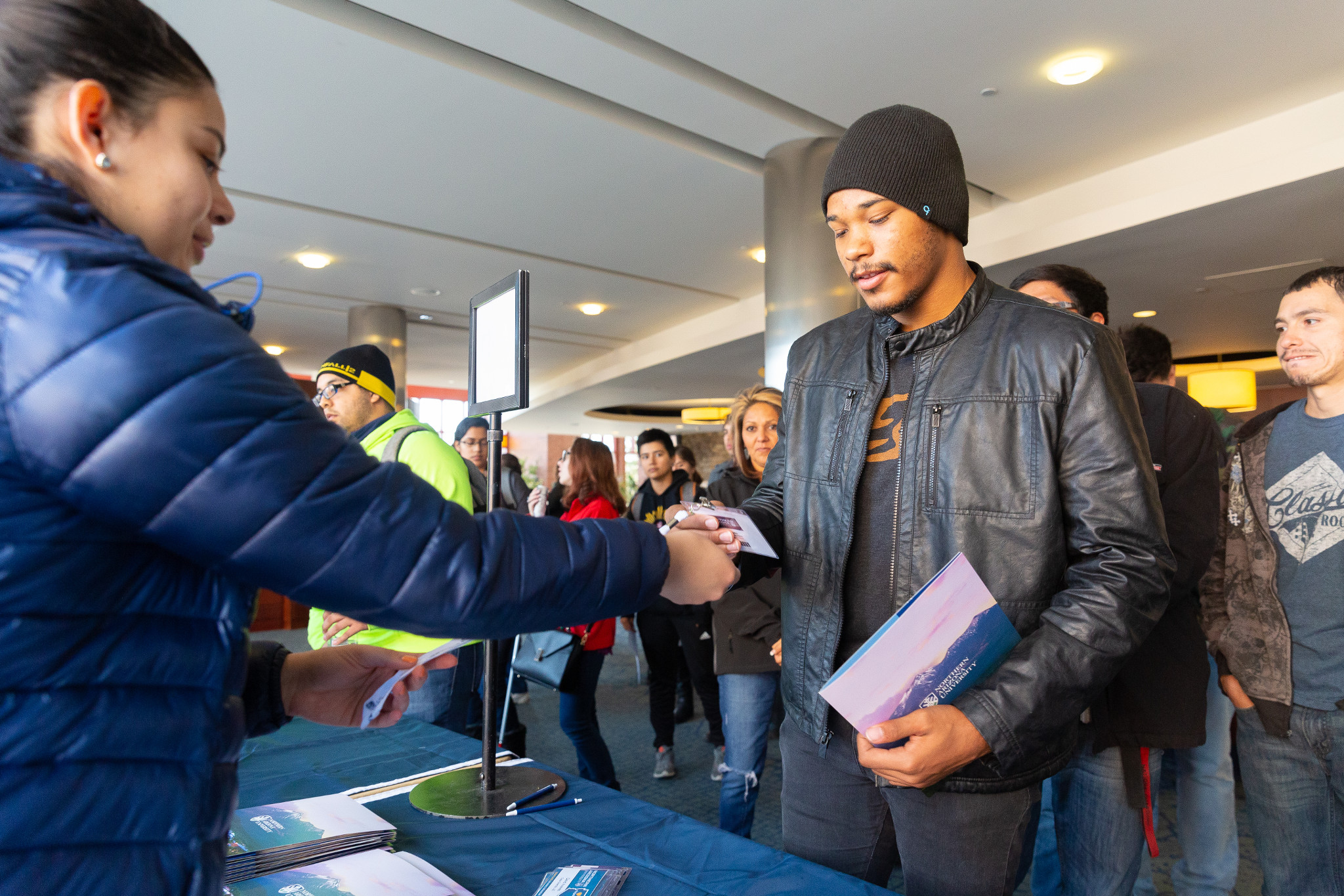 Student gets information at table about Transfer Day.