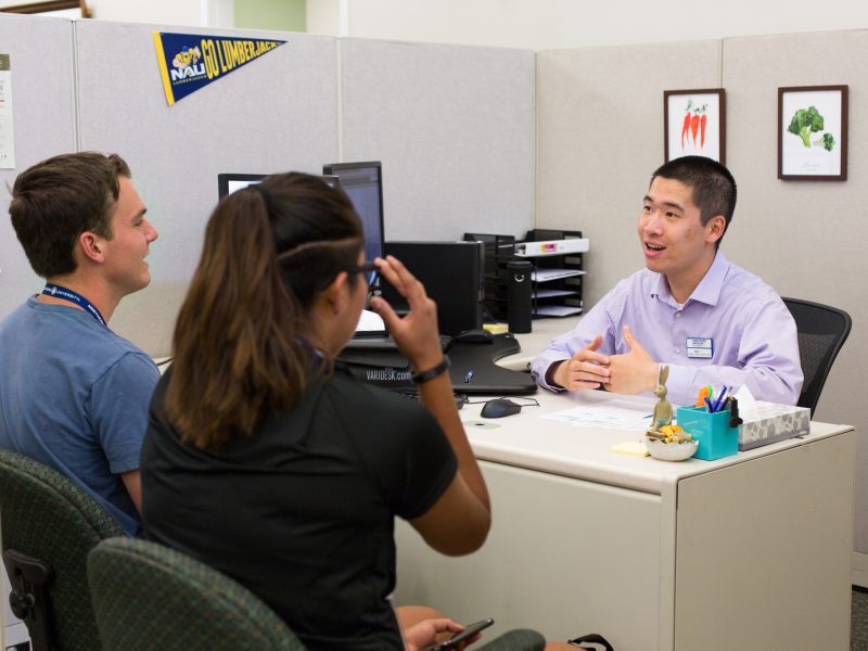 Students getting helped by an advisor.