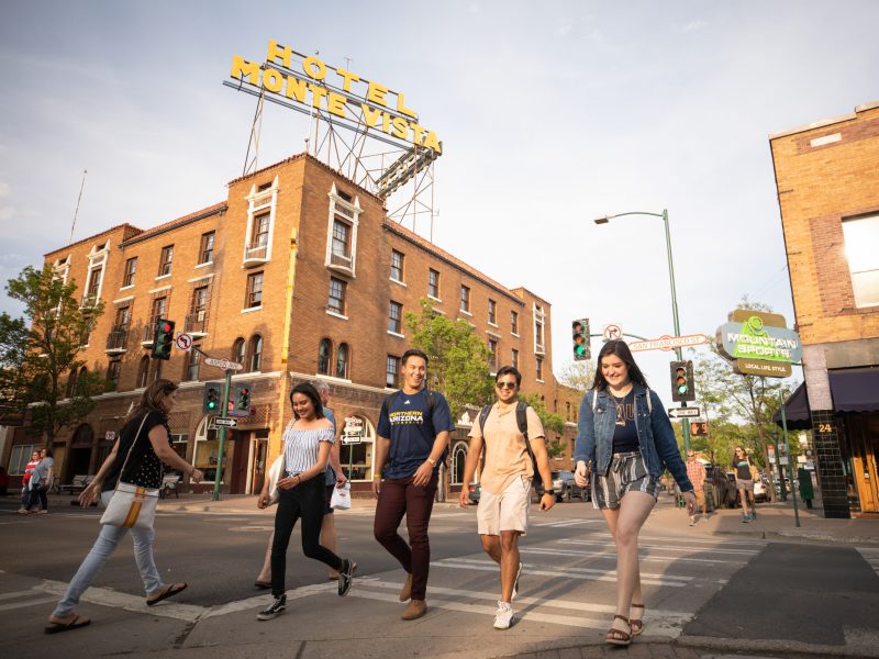 Students crossing a crosswalk in downtown Flagstaff.