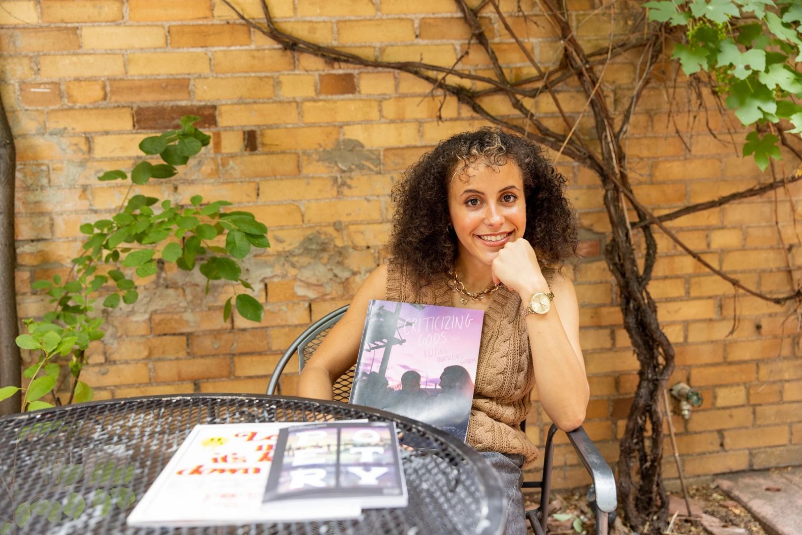 Merryman poses with her magazine outside of late for the train in Flagstaff.