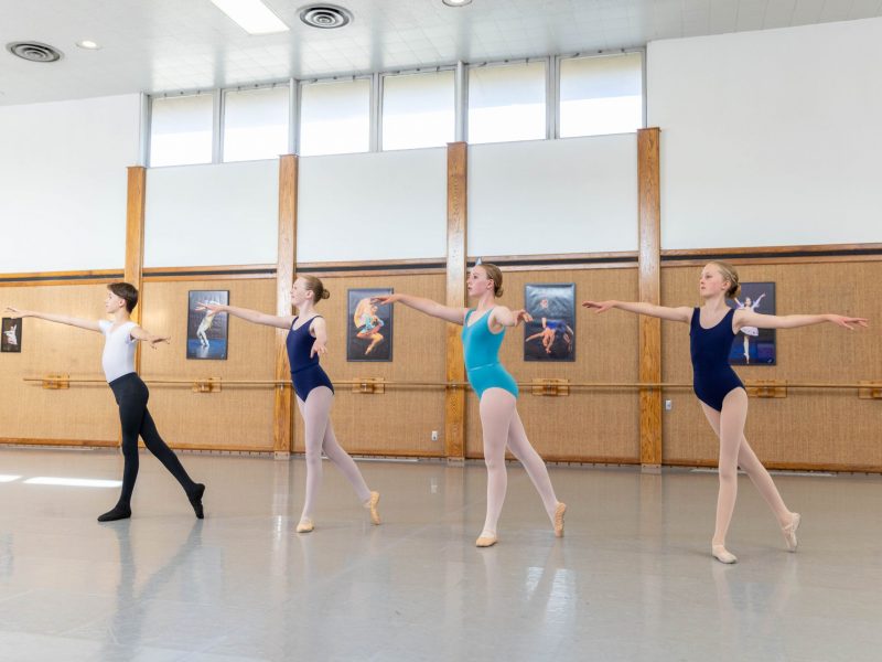 A group of four ballerinas posing.
