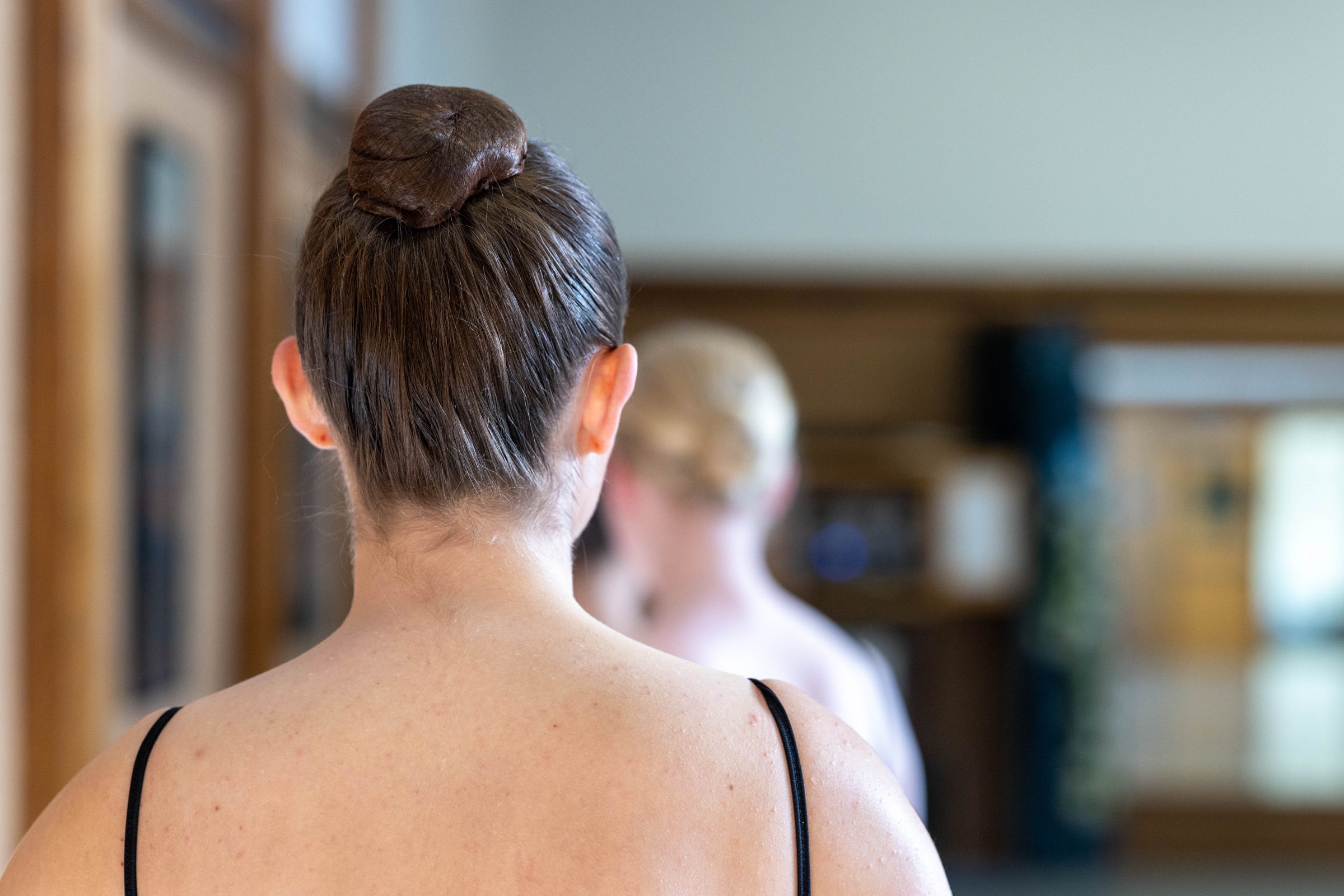 The back of a ballerina's head.