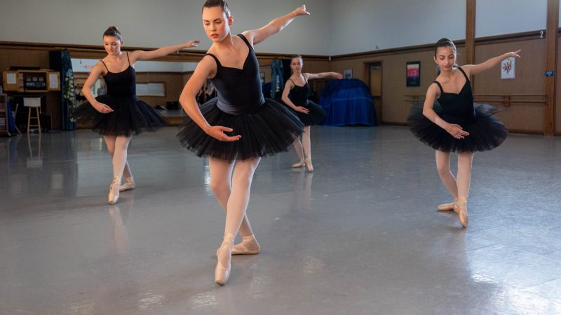 Four ballerinas posing.