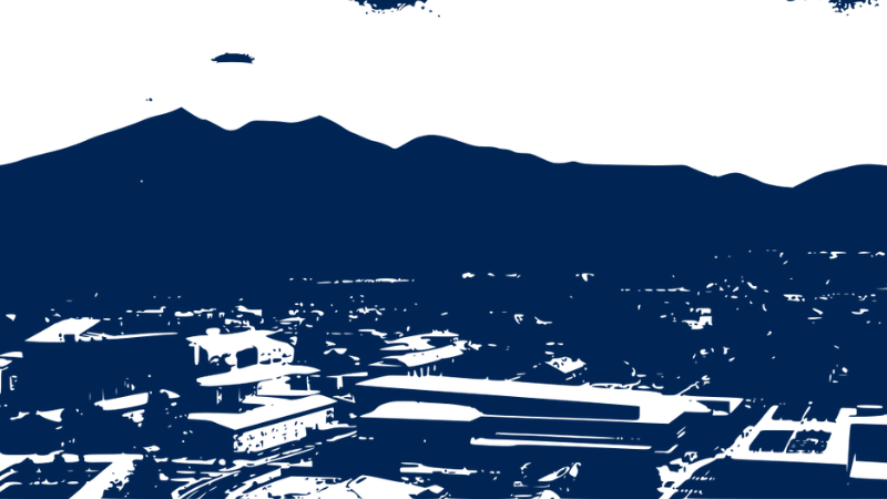 blue and white high contrast aerial view of campus and the peaks