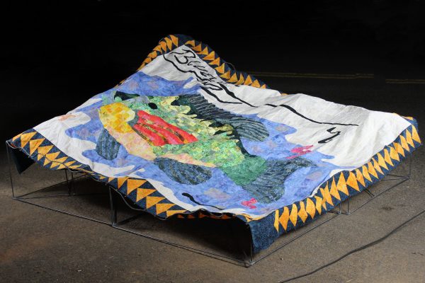 A fabric blanket of a fish titled "Sunfish Surprise."