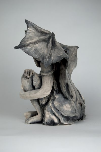 Sculpture of a humanoid creature with wings called "Nocturnal."