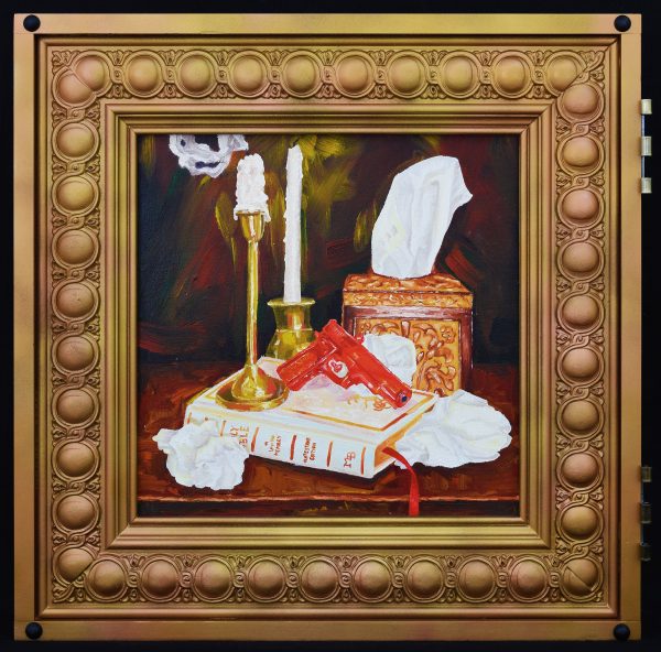 An assortment of items on a table including a handgun and tissue paper.