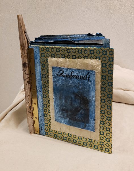 A mixed media book with the title "Rembrandt."