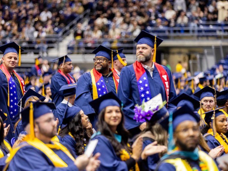 Veterans standing proudly at N A U commencement.