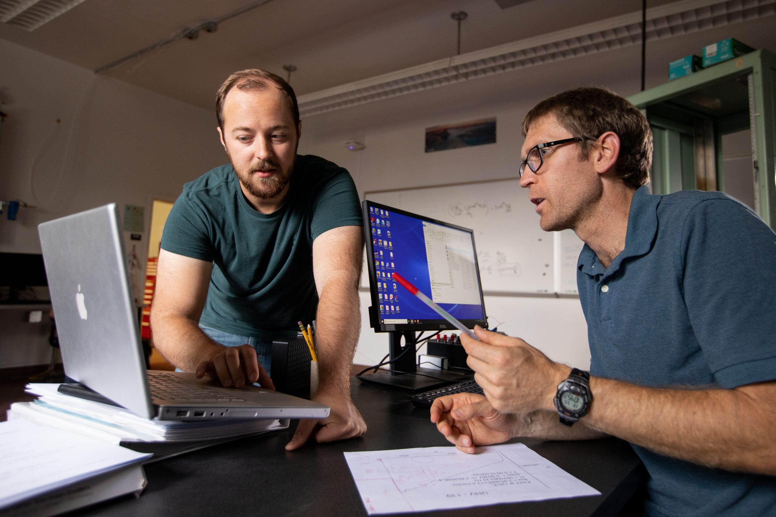 Two Northern Arizona University graduate students working on a project together.