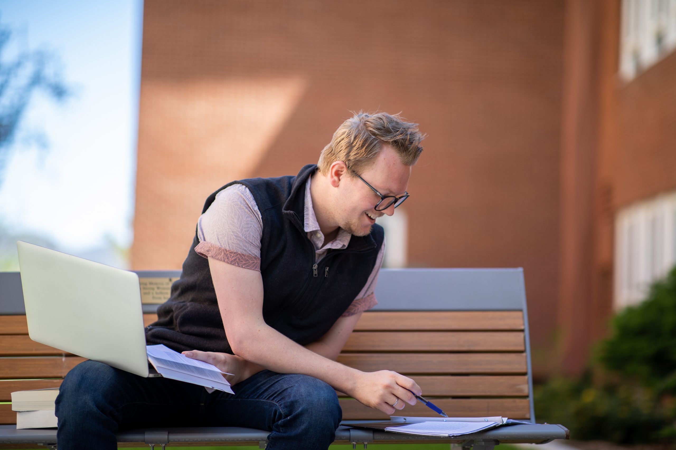An N A U graduate student works from their computer.