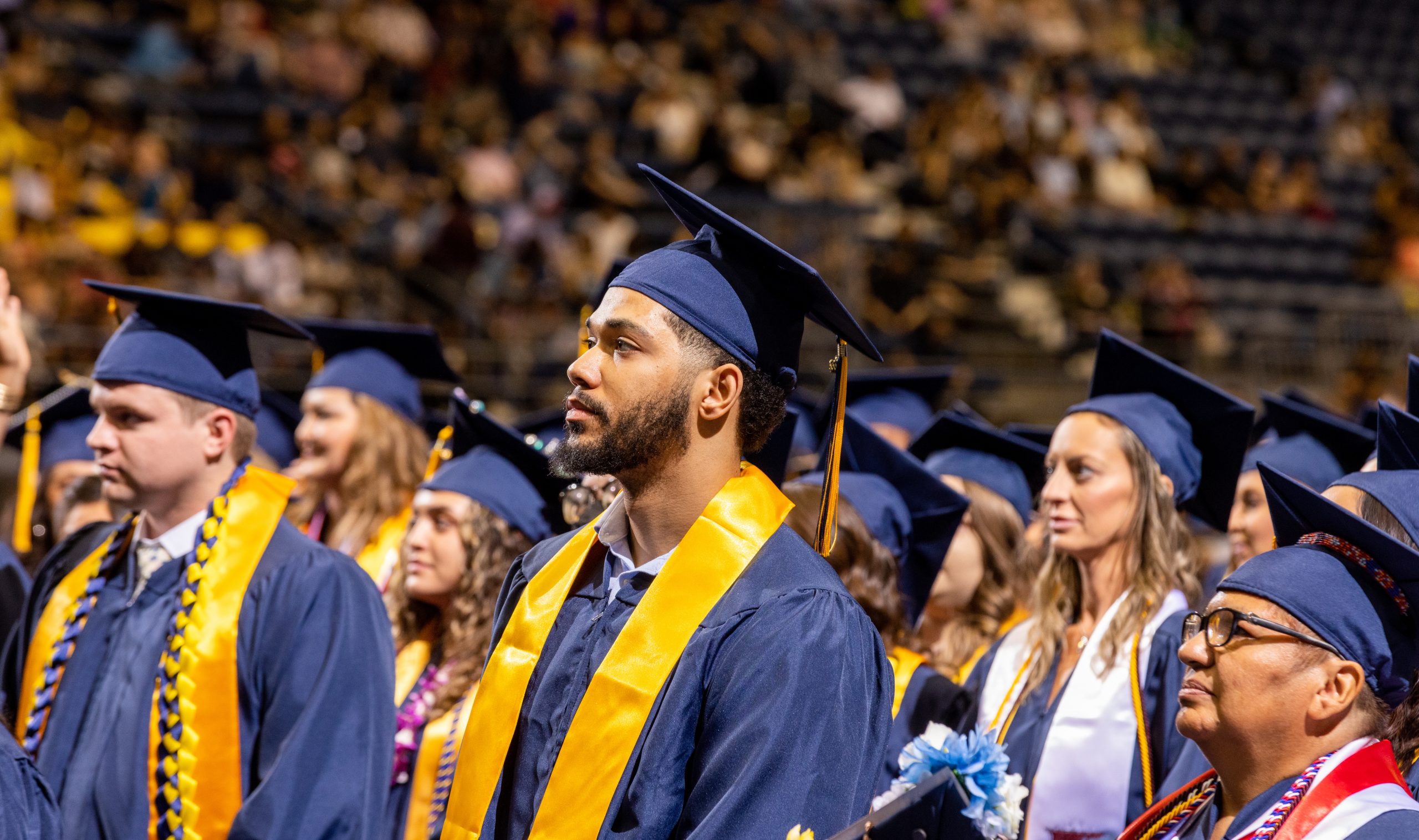 N A U Online students stand proudly at commencement.