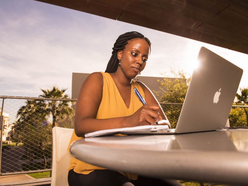 An N A U Online student attends class from their laptop.