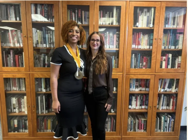 student and professor pose at outstanding students ceremony, spring 2026