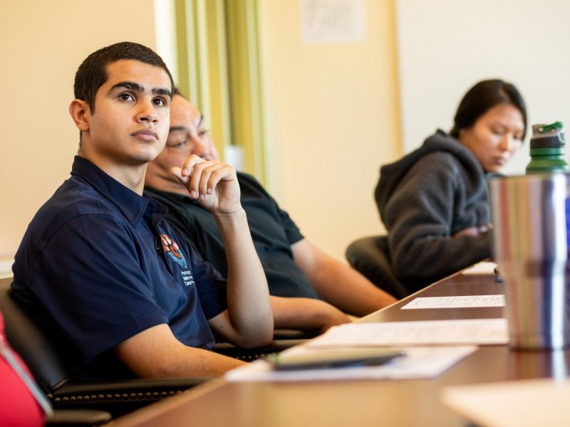 Student looking up at instructor.
