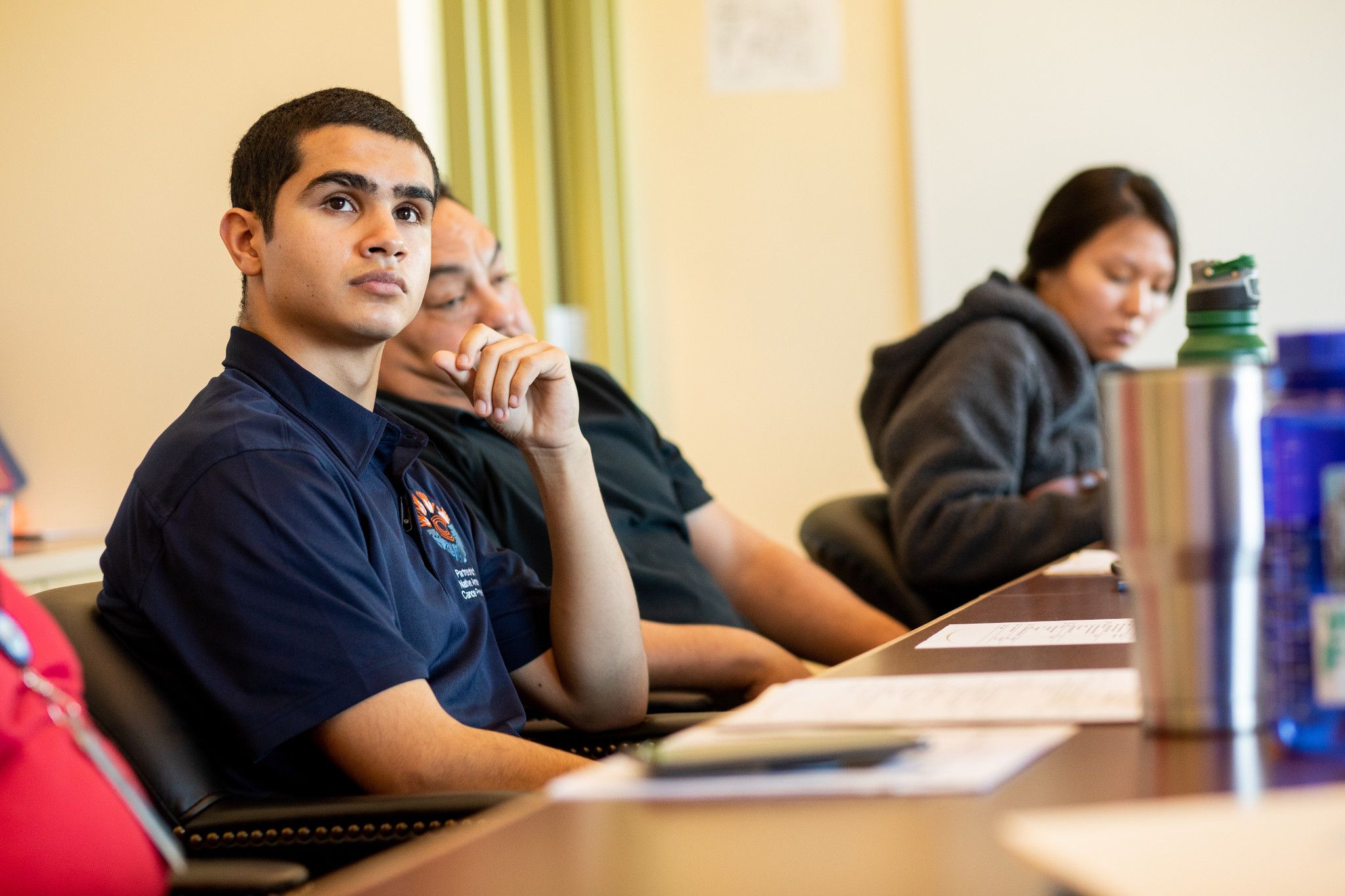 Student looking up at instructor.