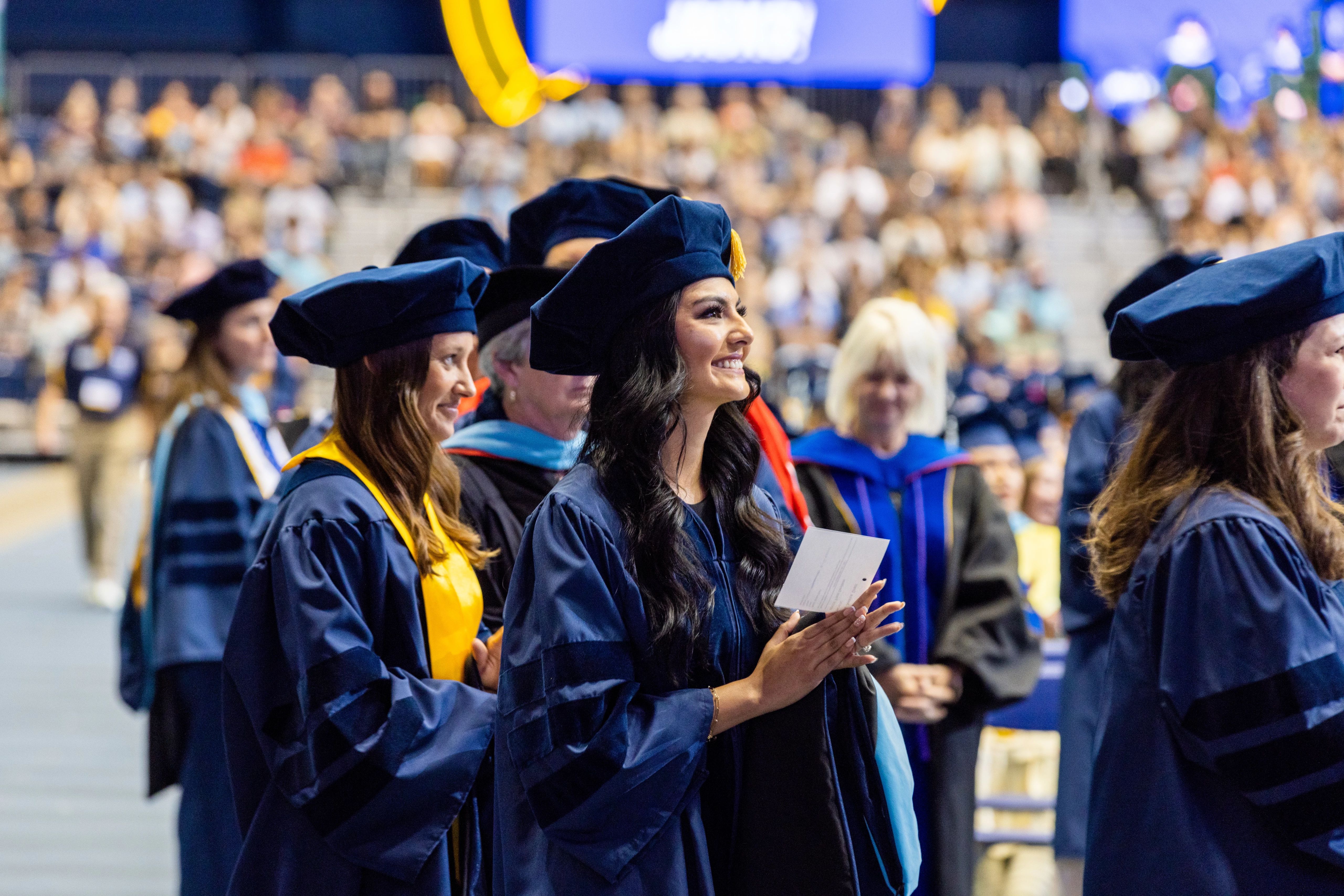 Graduates smiling.