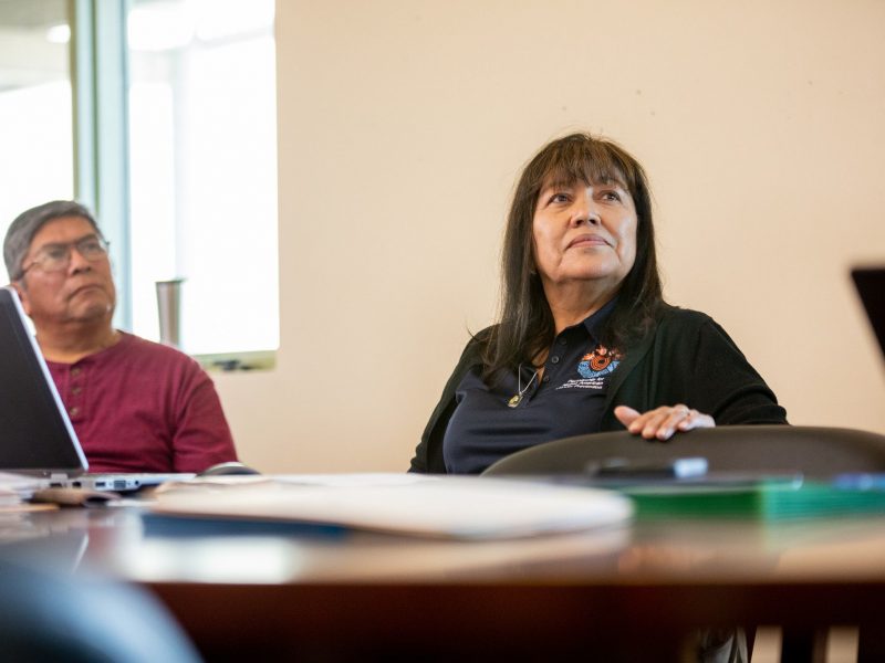 N A U faculty looking up at speaker in classroom.