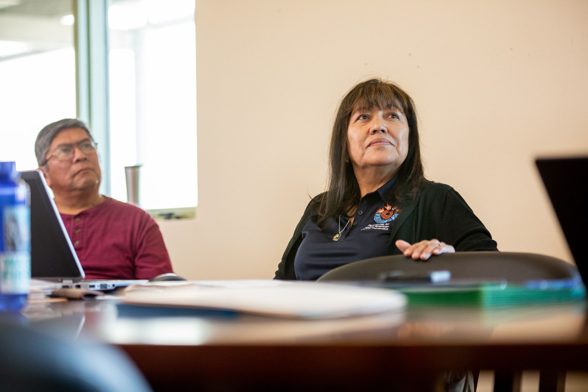 N A U faculty looking up at speaker in classroom.