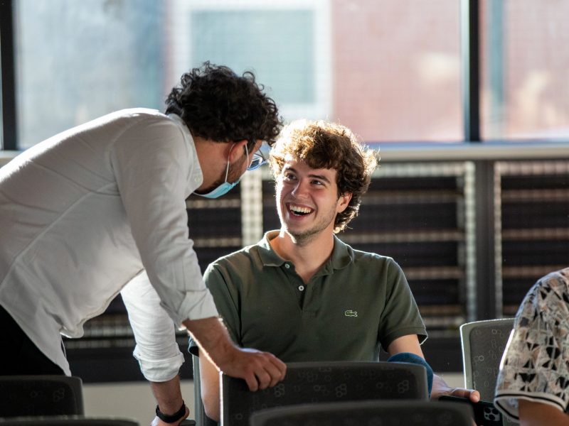 Student smiling at each other.