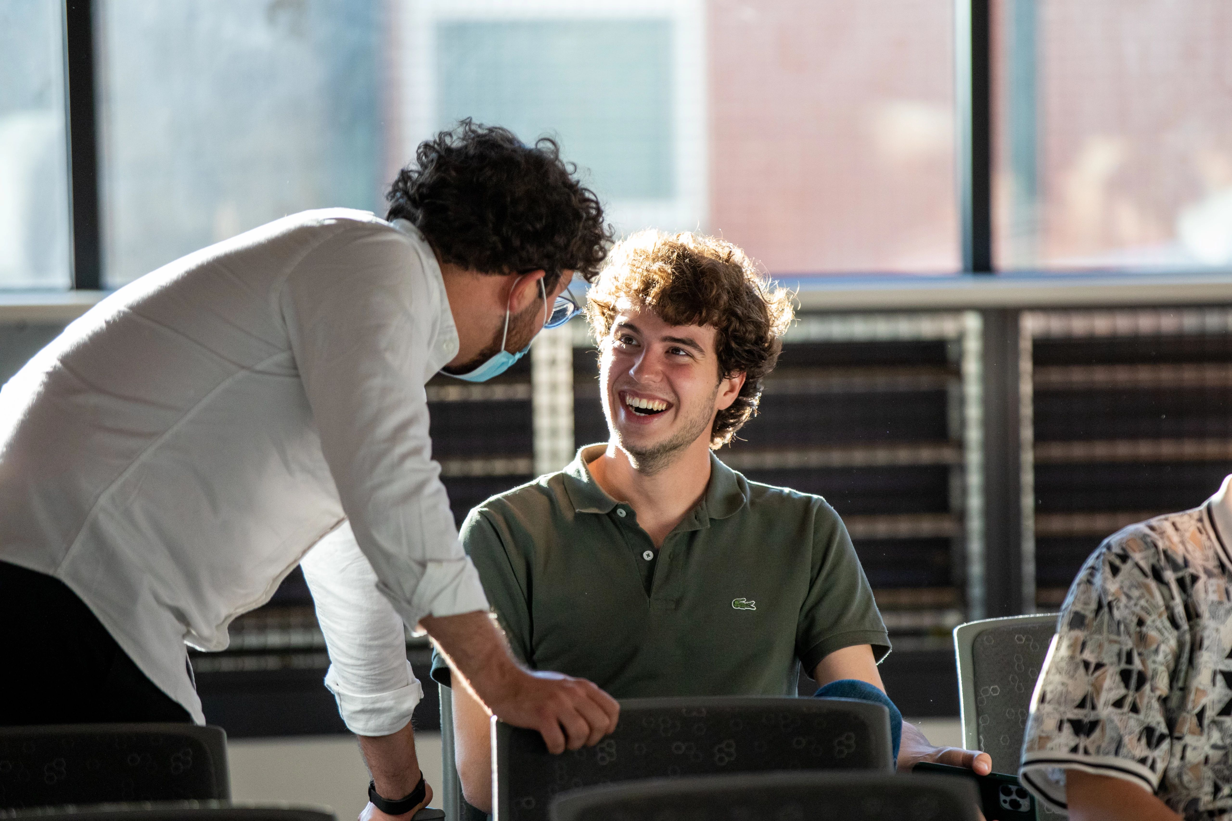 Student smiling at each other.