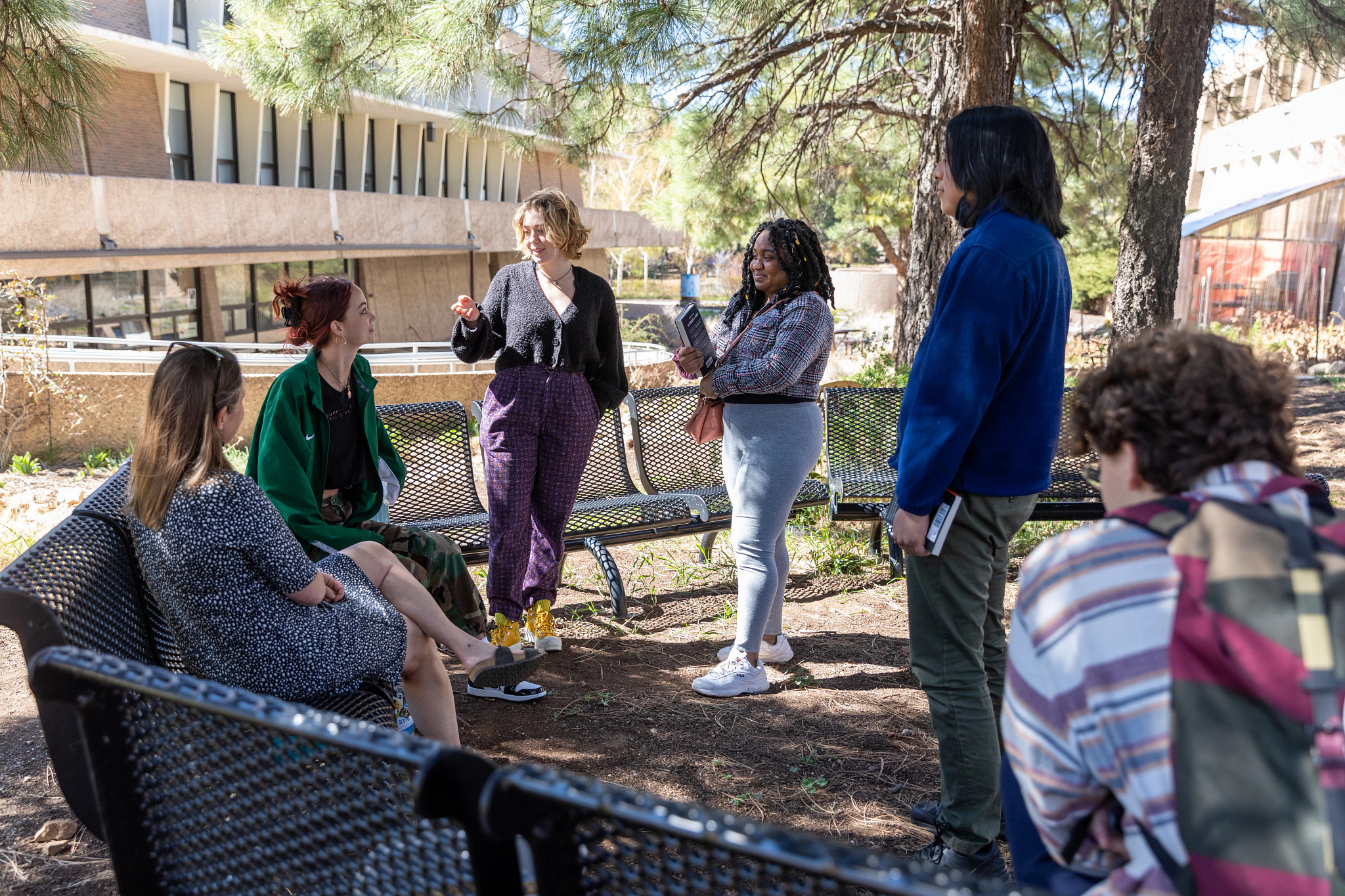 Group of N A U students talking to each other outside.