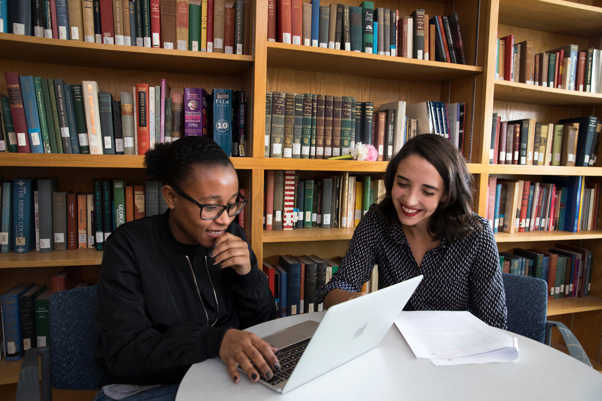 N A U students studying together on a laptop.