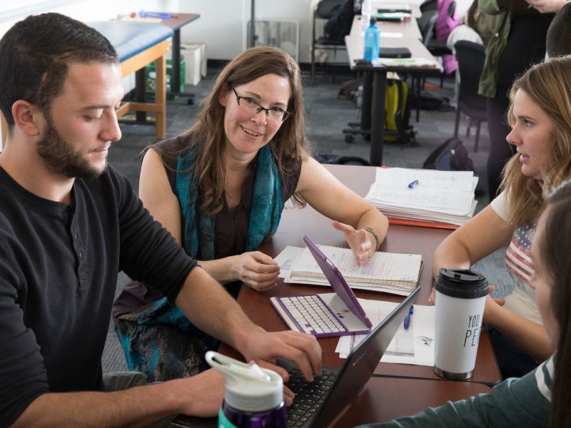 Student working with professor.