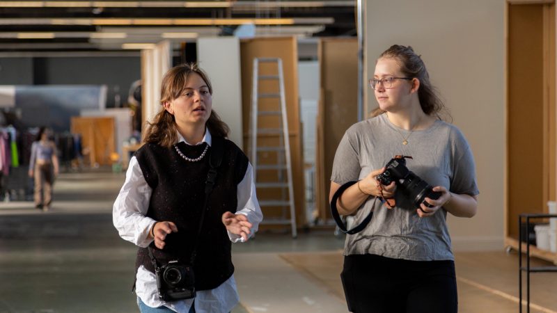 Students walking and discussing.