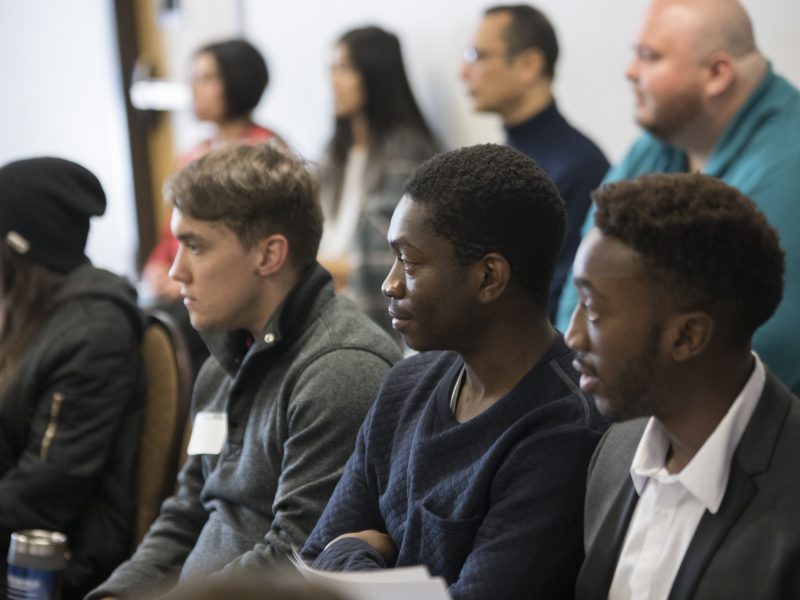 N A U students listening to someone speak in class.