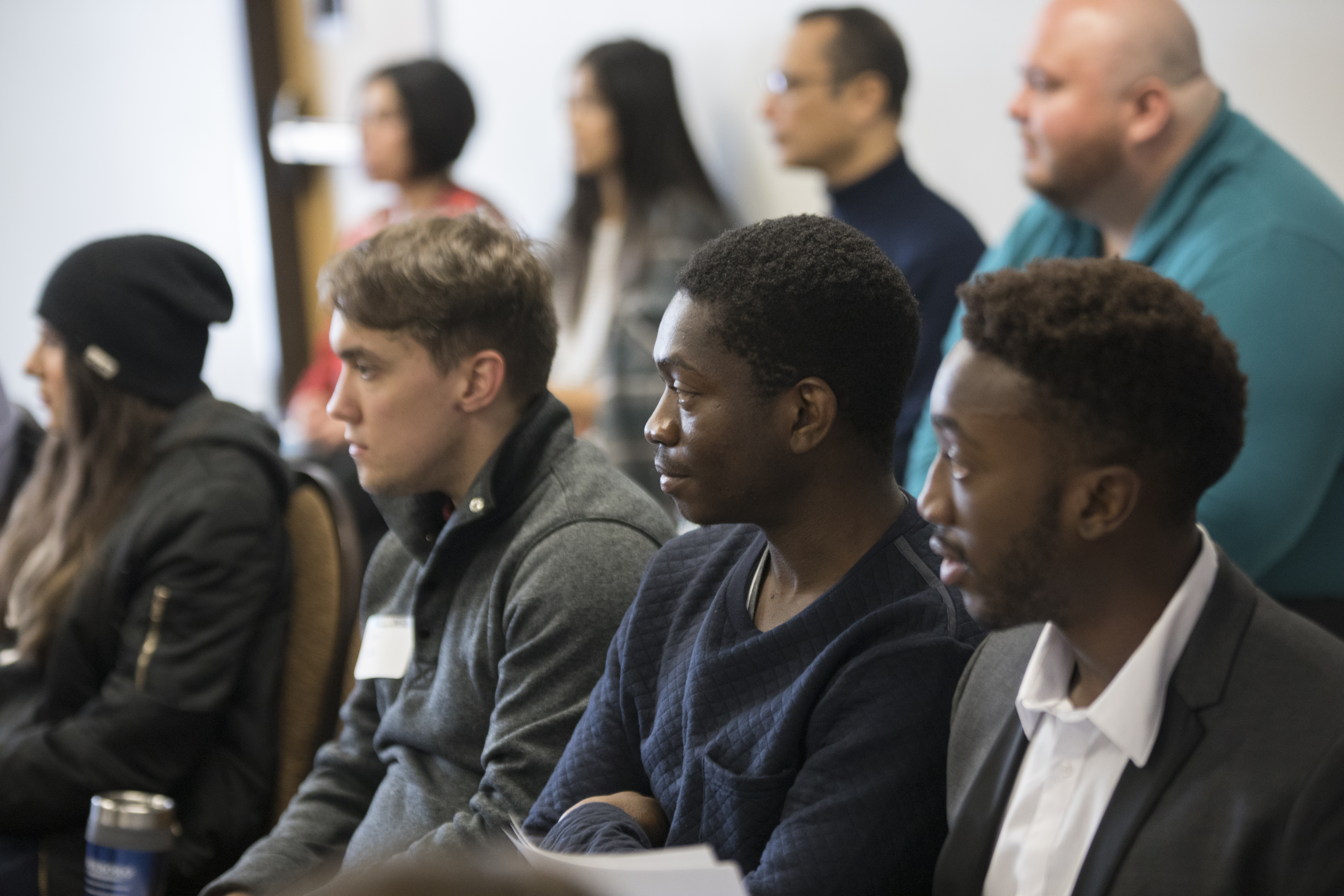 N A U students listening to someone speak in class.