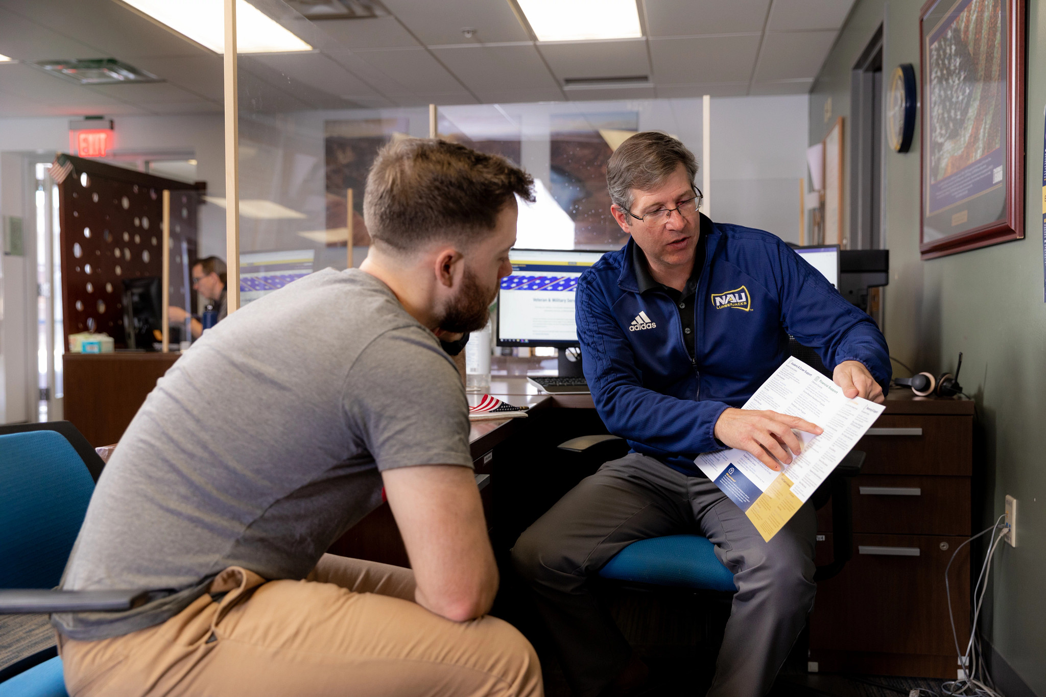Student being helped by advisor.