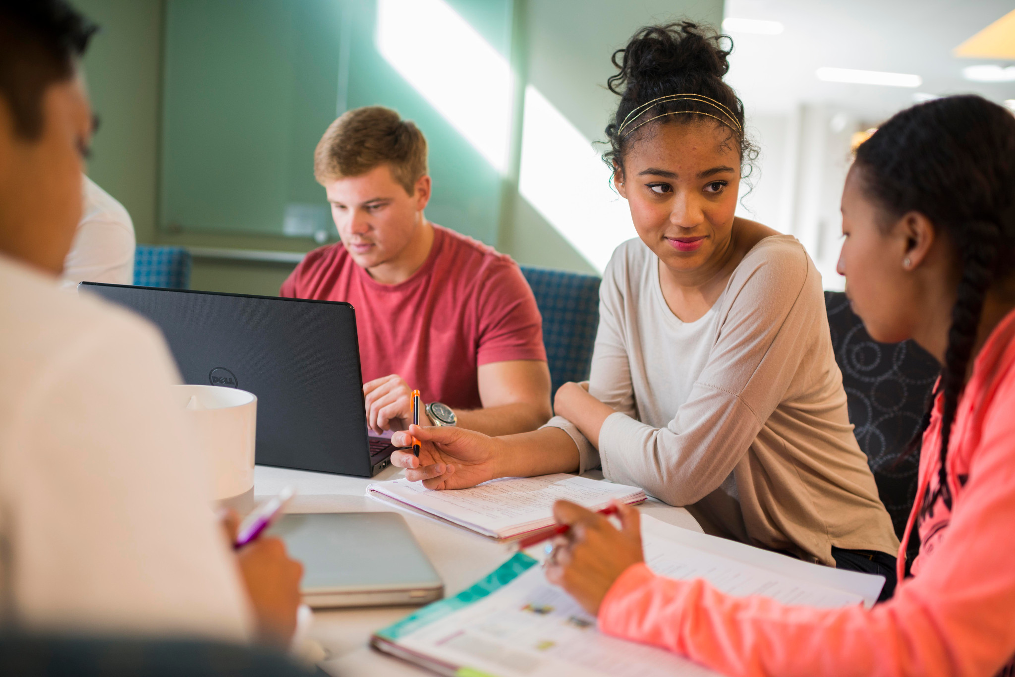 Students working together at a table.