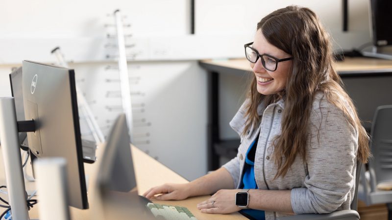 Student working on a computer in a N A U lab.