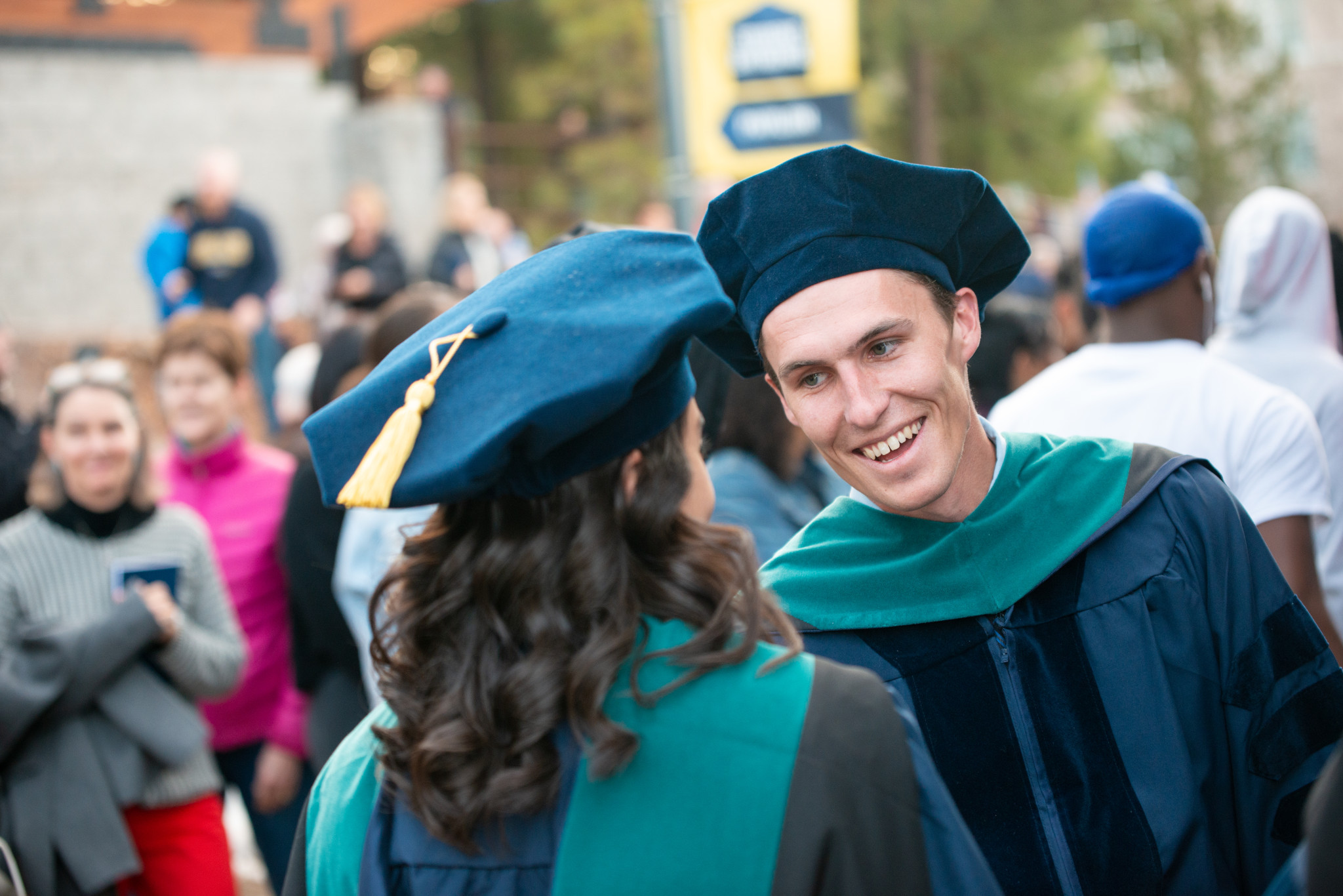 Students shaking hands at graduation.