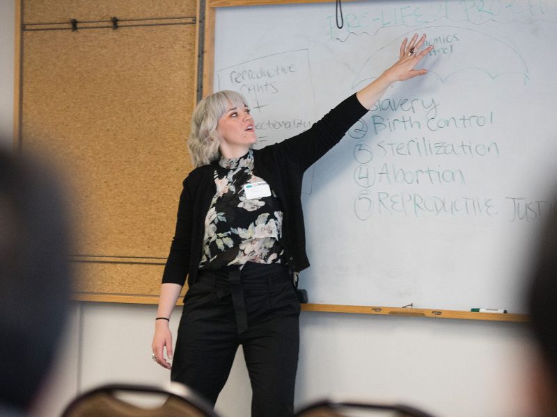 Professor speaking in front of a class.