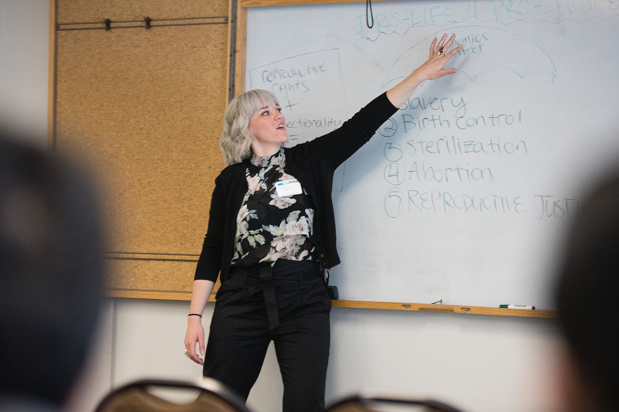 Professor speaking in front of a class.