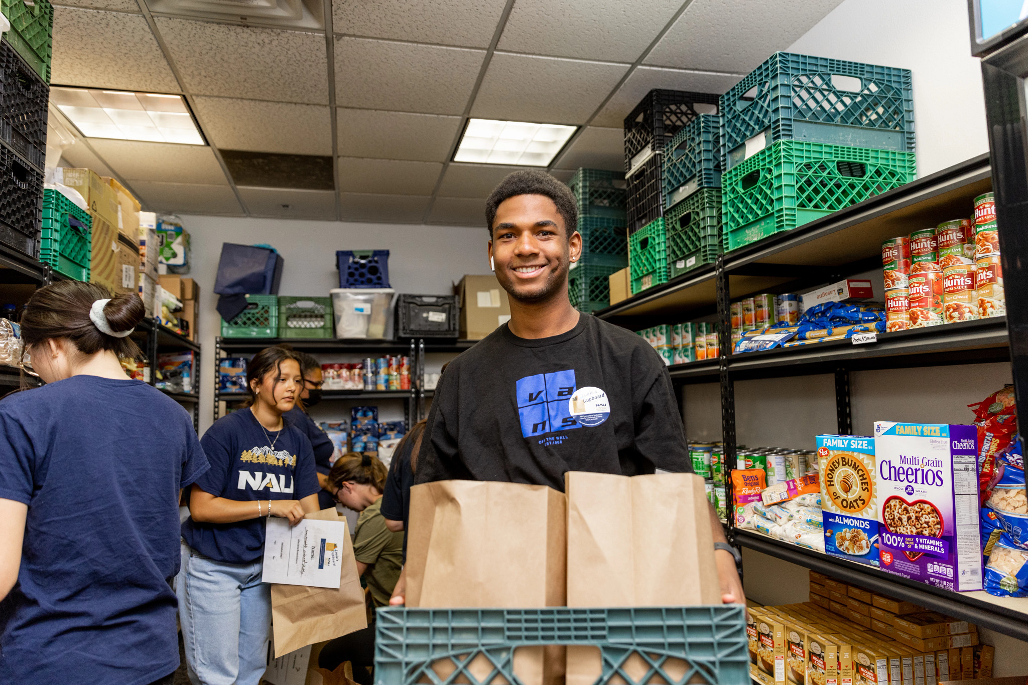 Student helping in food drive.