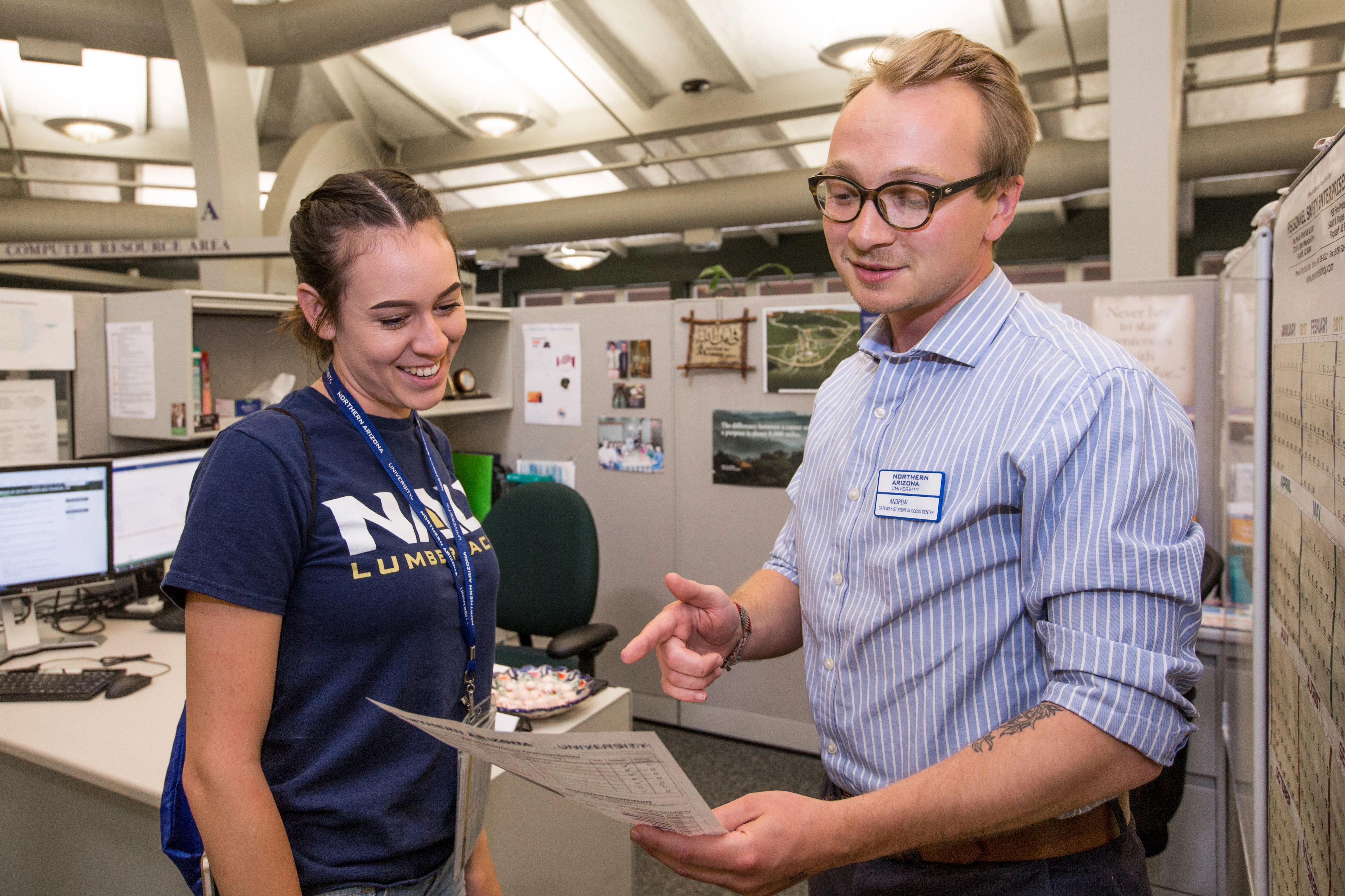 Student and advisor discussing.