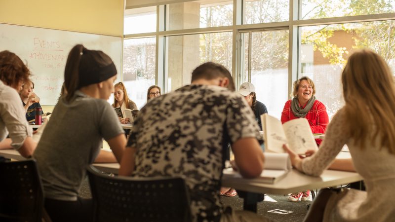 Honor students reading collectively.