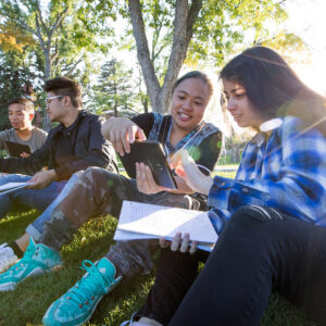 student looking at paper together.