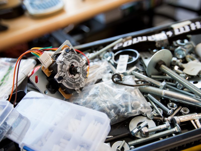 Box of metal hardware components.