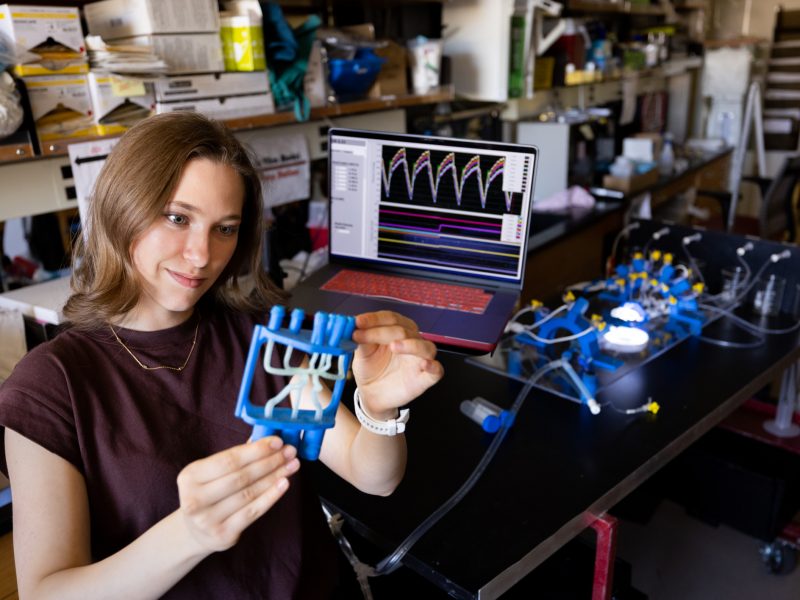 Student researcher working with equipment.