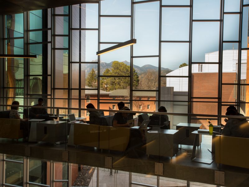 Students sitting by the window in the Science and Health building.